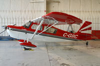 C-GIIC @ YXU - Parked inside the Executive Aviation hangar. - by topgun3