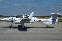 N142AR @ YXU - Parked in front of Katana Kafe. - by topgun3