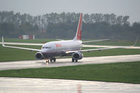 OE-LNS @ LOWG - taxiing in after a rainy landing