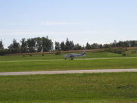 N181TK @ KLVN - Landing Runway 12. - by Mitch Sando