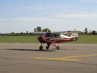 N9713D @ KFBL - Starting up on the ramp at Faribault. - by Mitch Sando