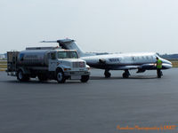 N16KK @ GSO - It's not Diet Coke he's putting in there but it will still do the trick - by J.B. Barbour