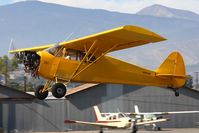 N3042M @ SZP - 1947 Piper PA-12 Cub Super Cruiser, operated uncowled for increased engine cooling for it's 180-hp engine, climbing out from RWY 22.