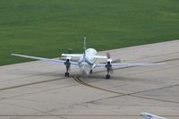 N850LS @ CID - Odd looking tail modification seen to good advantage.  Taxiing for departure on Runway 13