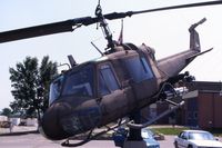 66-15185 @ ALO - Huey mounted at the Army National Guard base