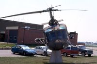 66-15185 @ ALO - Huey mounted at the Army National Guard base
