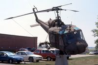 66-15185 @ ALO - Huey mounted at the Army National Guard base