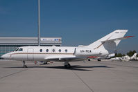UR-MOA @ VIE - Falcon 20