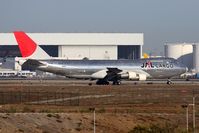 JA8180 @ LAX - JAL Cargo JA8180 taxiing off of RWY 24R after arrival.