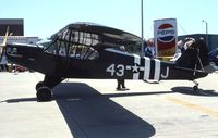 UNKNOWN @ UGN - Piper L-4 at the AAA fly In.  Lost the ID.