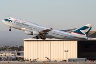 B-HUG @ LAX - Cathay Pacific B-HUG (FLT CPA885) climbing out from RWY 25R enroute to Hong Kong Int'l (VHHH). - by Dean Heald