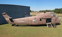 145728 @ SSF - Sikorsky H-34, Texas Air Museum, museum person said it was left behind by a company that moved to California, photo stitched from 2 images. BuNo 145728.  Being restored in Army colors. Was all white in 2001 - by Timothy Aanerud
