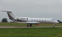 N404QS @ EGGW - on a busy day at Luton Airport (UK) - by Terry Fletcher
