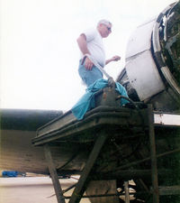 N44GH @ DTO - Glenn Hyde at work on his Super R4D - - this aircraft served as a USN Blue Angels support aircraft between 