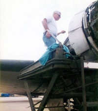 N44GH @ DTO - Glenn Hyde at work on his Super R4D - - this aircraft served as a USN Blue Angels support aircraft between  - by Zane Adams