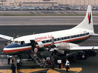 N73121 @ KBUR - American Eagle CV580 loading up for its next flight - by John Meneely