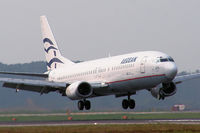 SX-BGS @ LIMC - Aegean 737 landing at Milan Malpensa - by Steve Hambleton