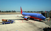 N435WN @ SNA - 737 getting ready to pull back from the gate - by Ken Freeze