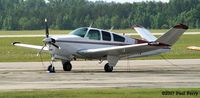 N77XF @ W03 - Love the colors, and the three blade prop - by Paul Perry