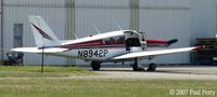 N8942P @ PVG - Got the door open; must be ready to get out, or get going. - by Paul Perry