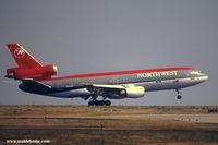 N159US @ LFPG - Northwest flight landing at Paris - by Michel Teiten ( www.mablehome.com )