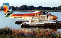 C-GCGW @ CYVR - Harbour Air's brightly coloured Sun Express Twin Otter c/n 434 later became 8Q-TMC and C-FDHT - by Terry Fletcher