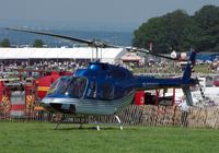 G-TOYZ - Helicopters arrive at the temporary Heliport on 2007 Epsom Derby Day (Horse racing) - by Terry Fletcher