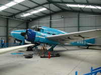 G-AHKX @ EGTH - Avro Anson undergoing some maintenance while on display at Old Warden Aerodrome
