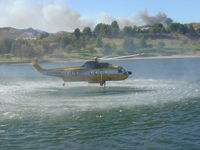 N61NH - loading water at Castaic Lake - by Jon Tallent