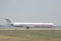 N497AA @ DFW - Rainy day at DFW - Holding short 18L