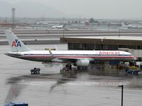 N179AA @ PHX - A very rainy day in normally sunny Phoenix. - by John Meneely