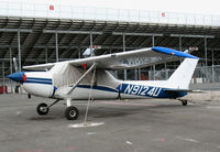 N9124U @ 4SD - 1976 tail-dragger Cessna 150M with cover @ Reno-Stead - by Steve Nation