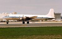 HI-592CT @ MIA - This DC6-B used to regularly operate for Aerochargo and Aeromar into Florida , but now lies derelict in the Dominican Republic . Interestingly originally registered as N6815C it worked as an Airborne TV Station , before being sold to LAN Chile - by Terry Fletcher