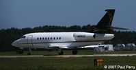 N89CE @ ORF - Interesting logo on the tail of this Falcon - by Paul Perry