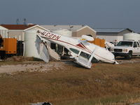 N4231P @ KNEW - Hurricane Katrina aftermath - by Tom Norvelle