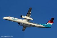 LX-LGA @ ELLX - Taking off on a cold winter afternoon on runway 06 - by Michel Teiten ( www.mablehome.com )