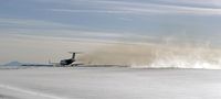 N689JE @ KAPA - Full take-off power and clearing the snow - by John Little