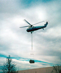 N504 - Working Helicopter - Lifting HVAC units onto a warehouse in north east Arlington, TX - by Zane Adams