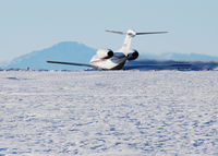 N987QS @ KAPA - Takeoff on 17L with Pikes Peak in the distance.