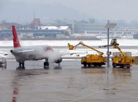 OE-LBQ @ LOWS - This Lauda A320 gets the de-icer treatment before its first rotation of the day from Salzburg - by Terry Fletcher