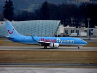 D-AHFY @ LOWS - HapagFly's B737 passes the Red Bull Maintenance Hangar on arrival to Salzburg - by Terry Fletcher