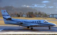 OE-FMK @ LOWS - Cessna 501 taxies out against the backdrop of the ancient Salzburg Fortress - by Terry Fletcher