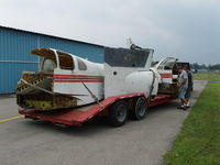 N52S @ SCH - After spending almost two decades at an A&P School in New Bedford, Mass., this unfortunate D50 Twin Bonanza was beyond economical repair. It was parted out to support the remaining fleet of Twin Bonanza's, then cut up and sent to the scrapyard. - by Gregg Cadieux
