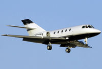 N800FF @ KSNA - Falcon coming in for landing! - by Mike Khansa