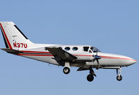 N37U @ KSNA - Cessna 414A on short final - by Mike Khansa