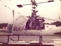 N28872 - 1961 Hiller UH-12E on a trailer parked at the Riverside Shopping Center in Danvill Va . - by Richard T Davis