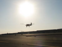 N7688M - Taking off into the sun set - by Thelma