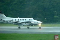 N745EA - Wal MartÂ´s Beech B200 N745EA taking off  under heavy rain at MROC - by Gabriel Pittelli