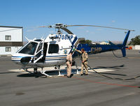 N708HP @ PRB - California Highway Patrol/CHP flight crew fueling 1999 Eurocopter AS 350 B3 @ Paso Robles Municipal Airport, CA - by Steve Nation
