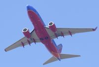 N296WN @ KSNA - Southwest B737-7H4 lifting off on a gorgeous day. - by Mike Khansa